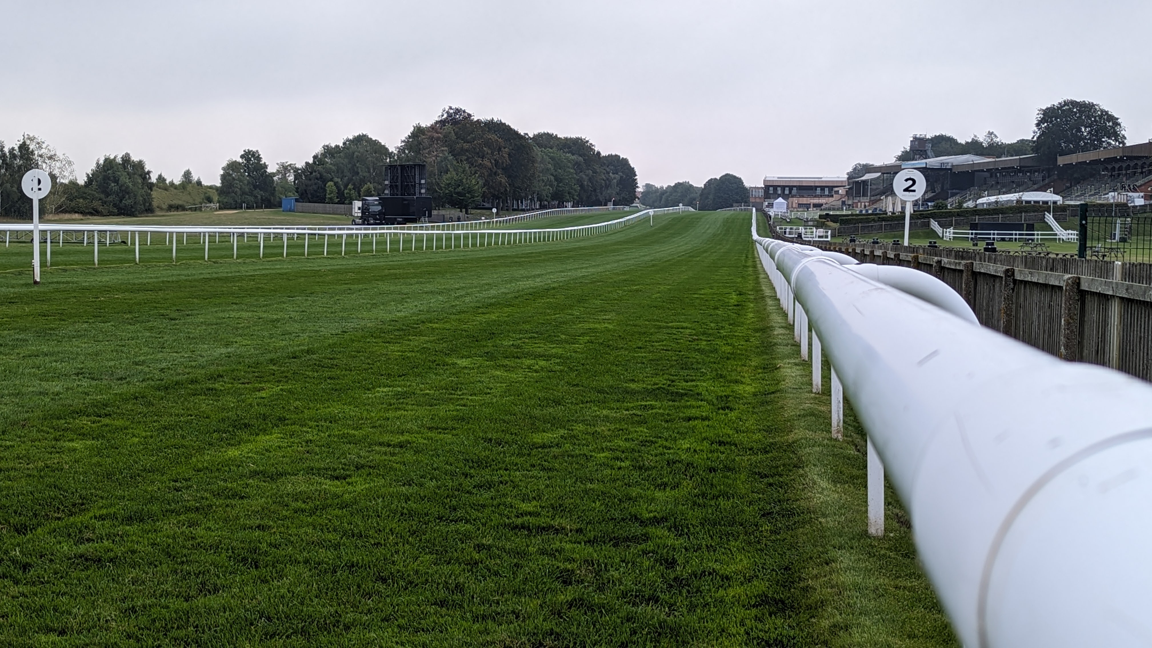Turf running surface with multiple course rails