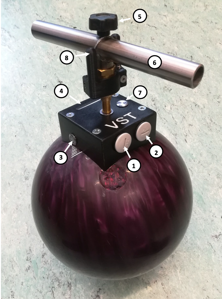 Photograph of the Vienna Surface Tester showing its sphere, handle and electronics